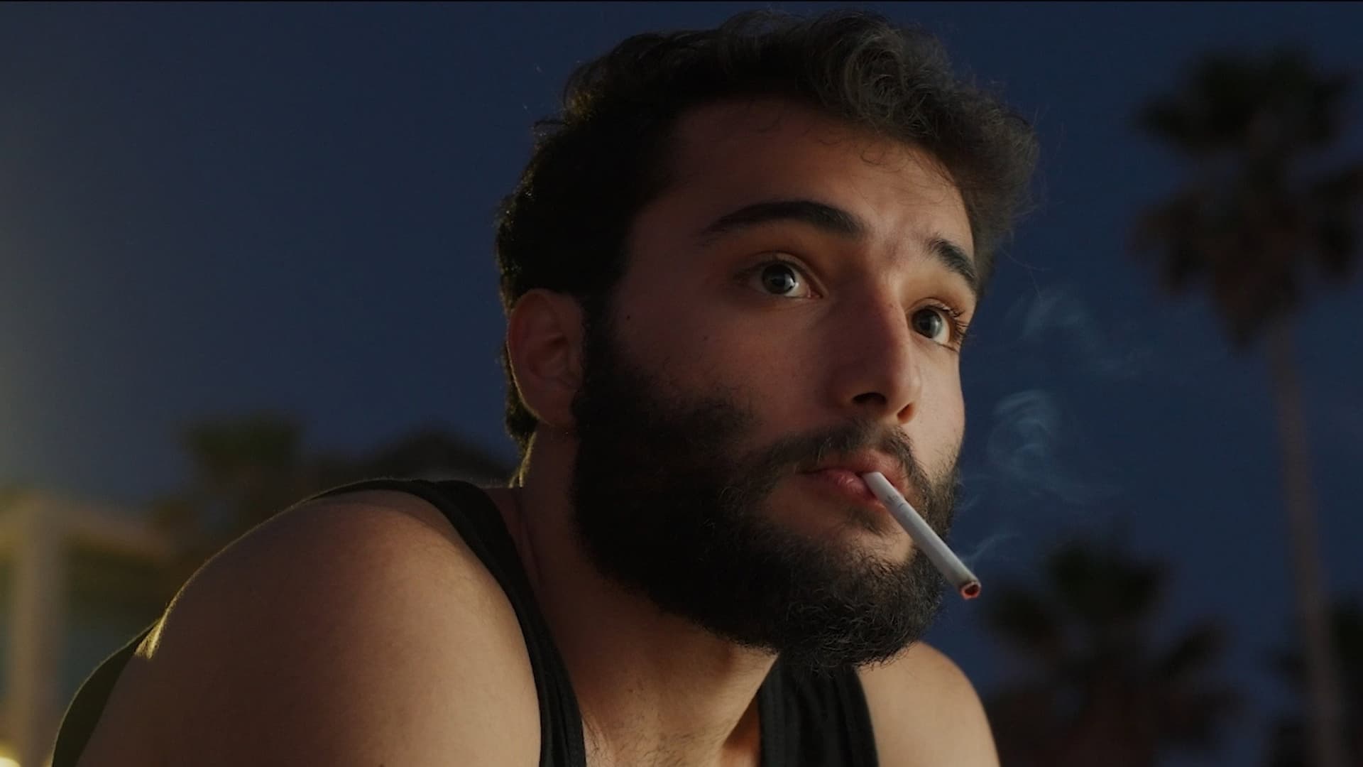 By the cigarette's light